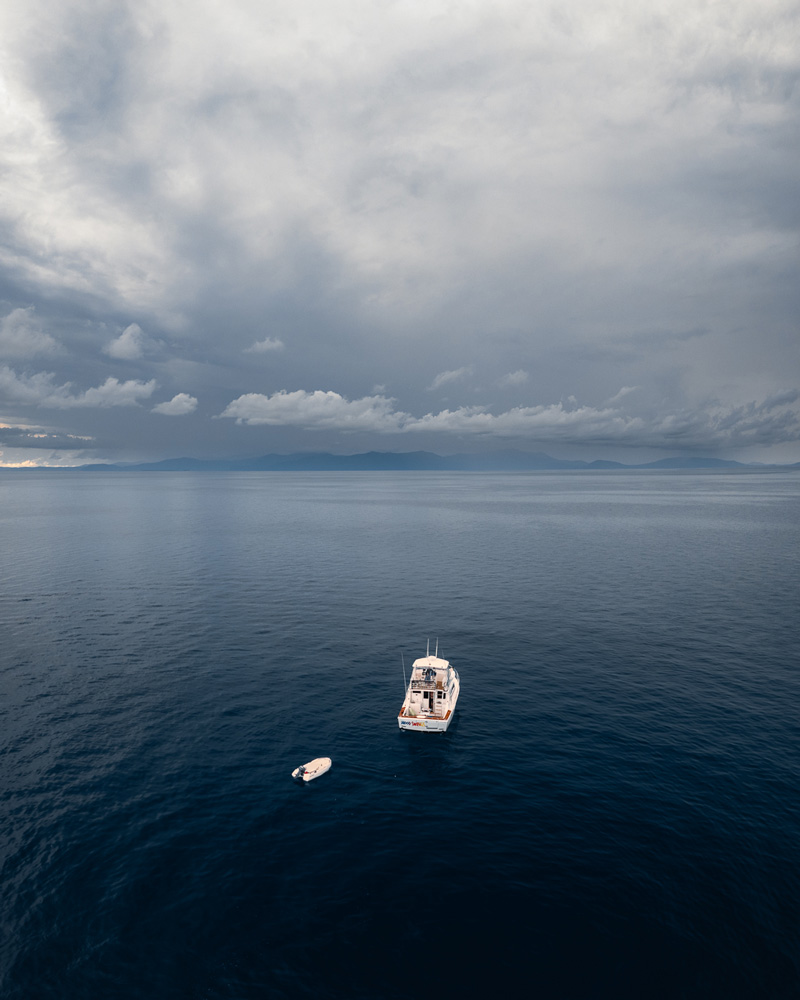 Storm clouds and boat at sea