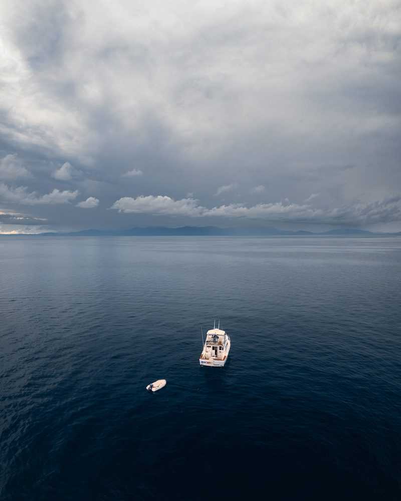 Storm clouds and boat at sea