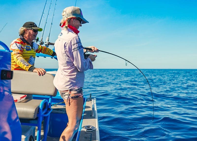 Woman catching big fish