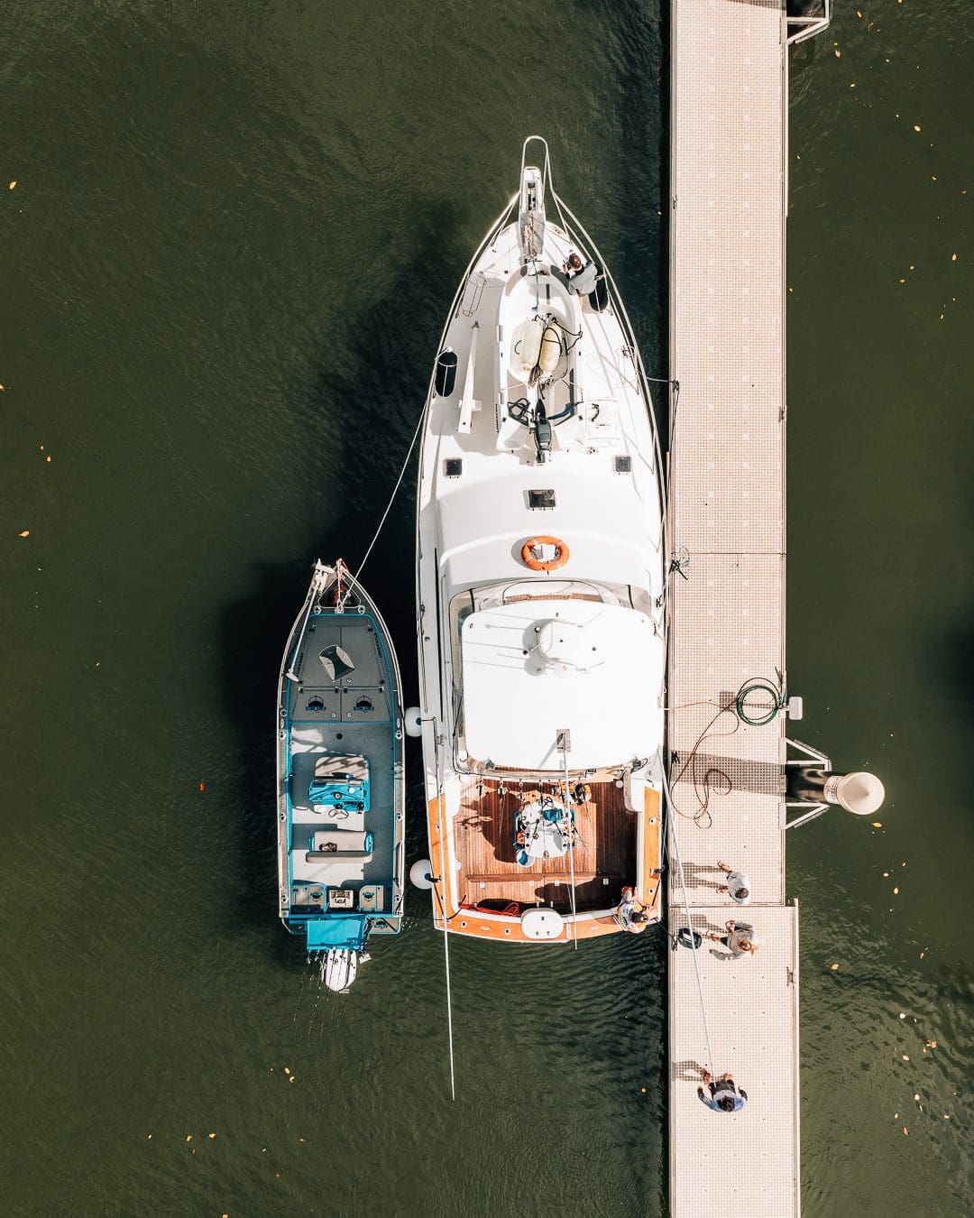 Boat tied up at pontoon awaiting repair