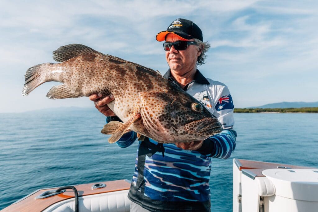 Large cod and fisherman