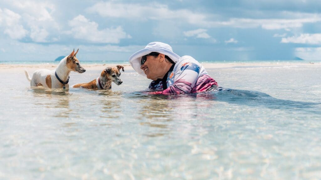 dog and woman in water