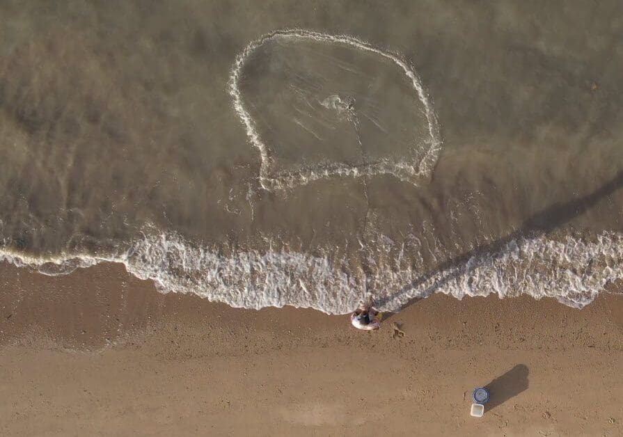 Casting a net to catch live bait