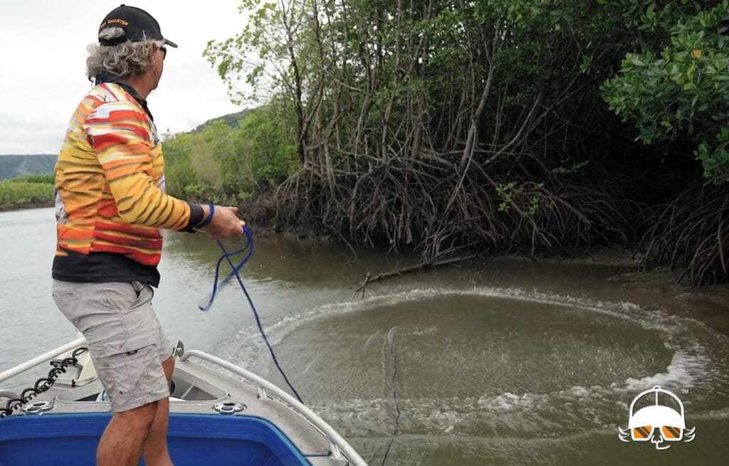 Throwing cast net in drain for mullet