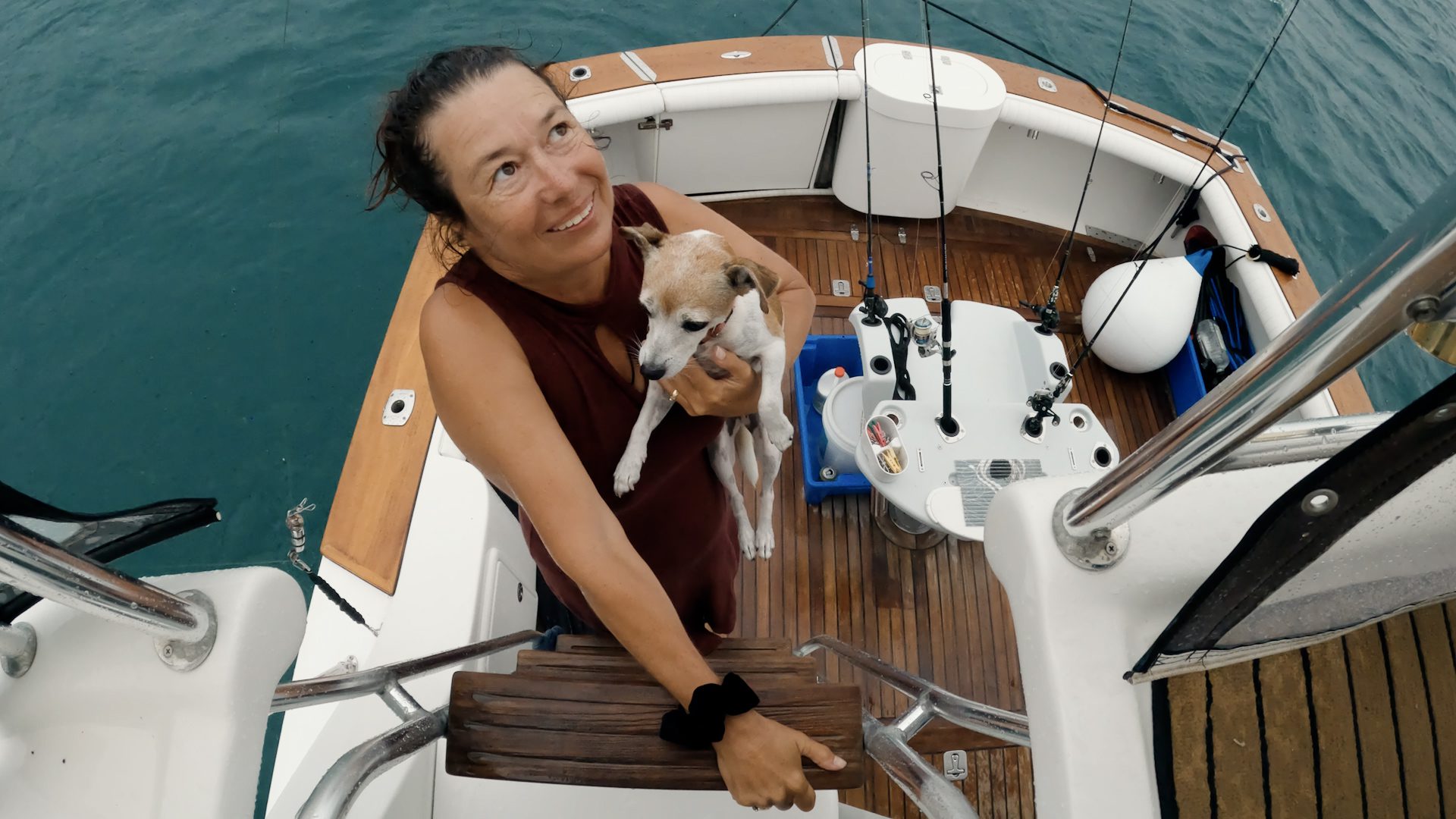 Woman and dog living on a boat