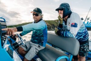 Golden Snapper fishing challenge - men looking for fish on their sounder.