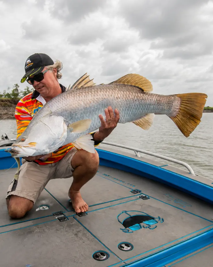 Ryan Moody holding a metre-plus barramundi