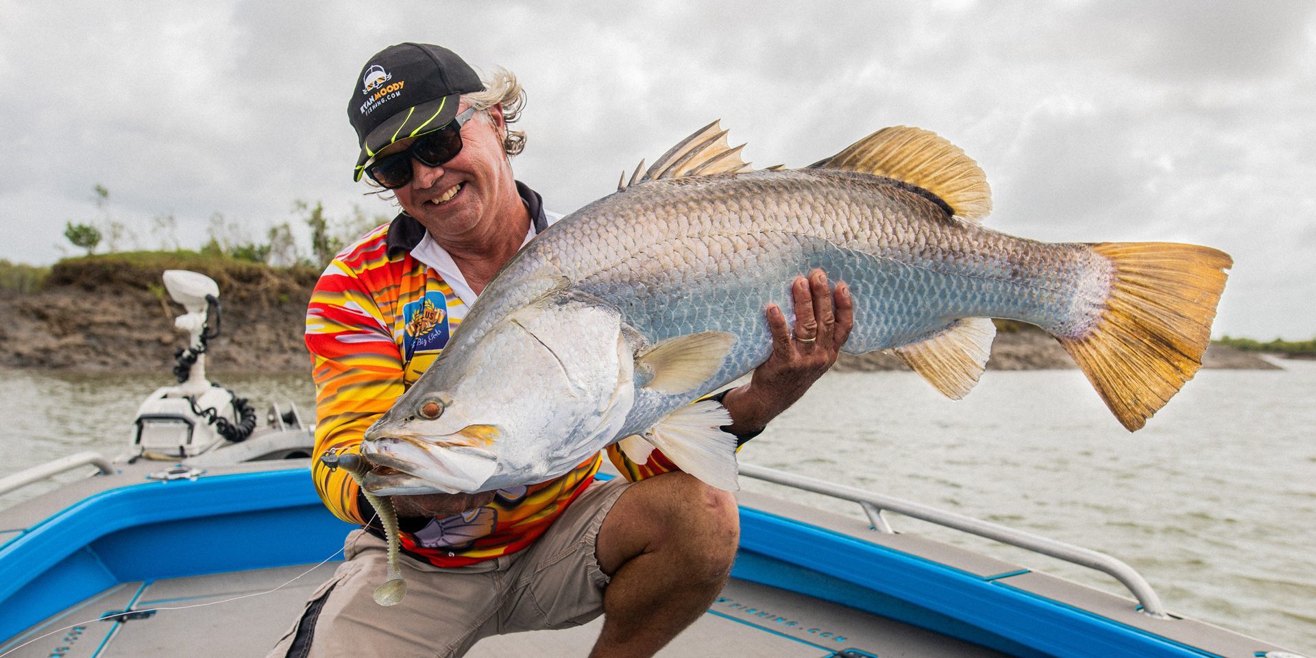 Ryan Moody holding a huge barramundi caught on a lure